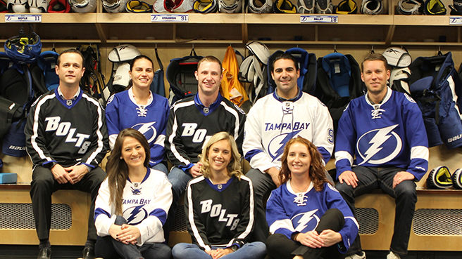 Fans sitting in the Lightning locker room