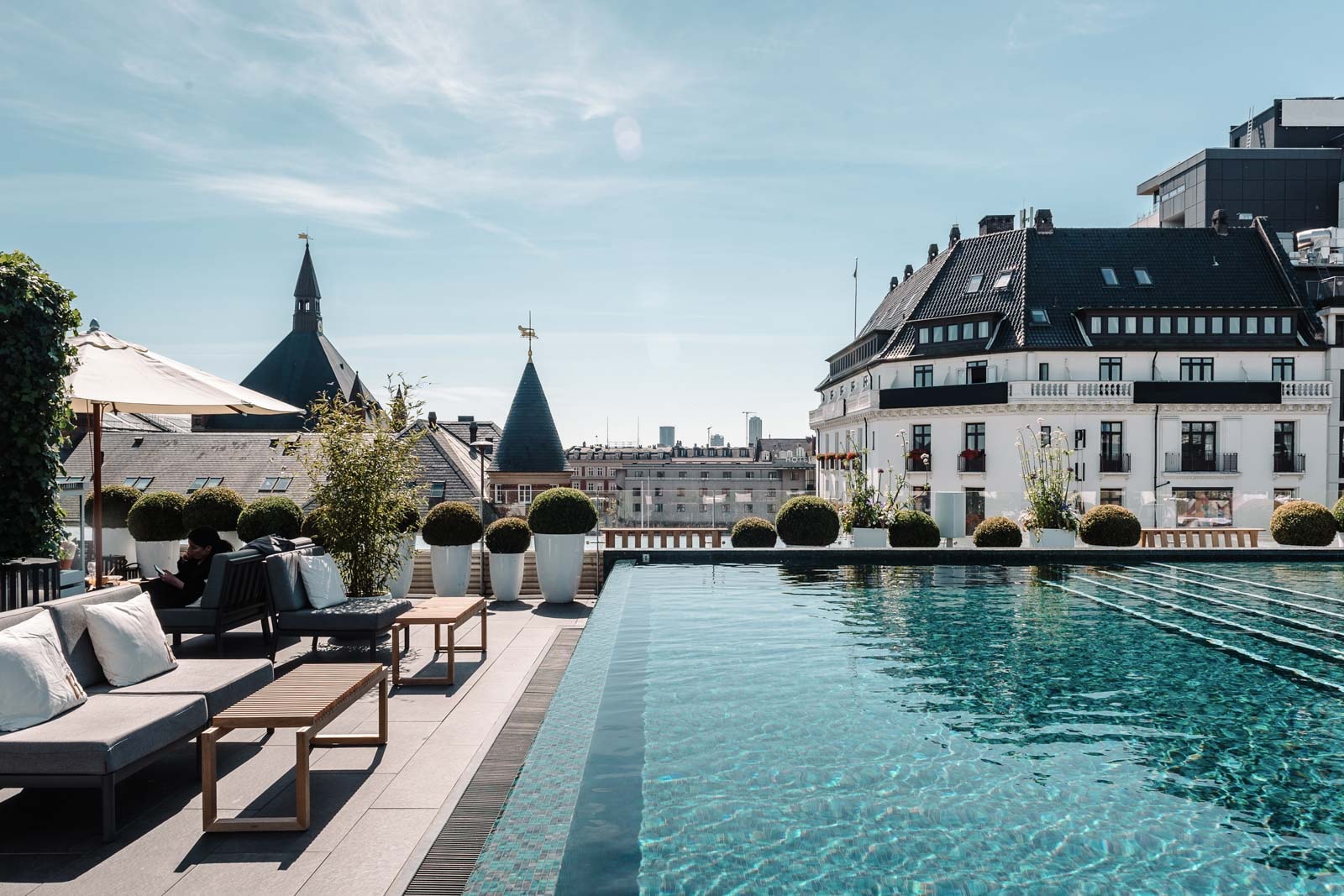 Rooftop pool with lounge seating.