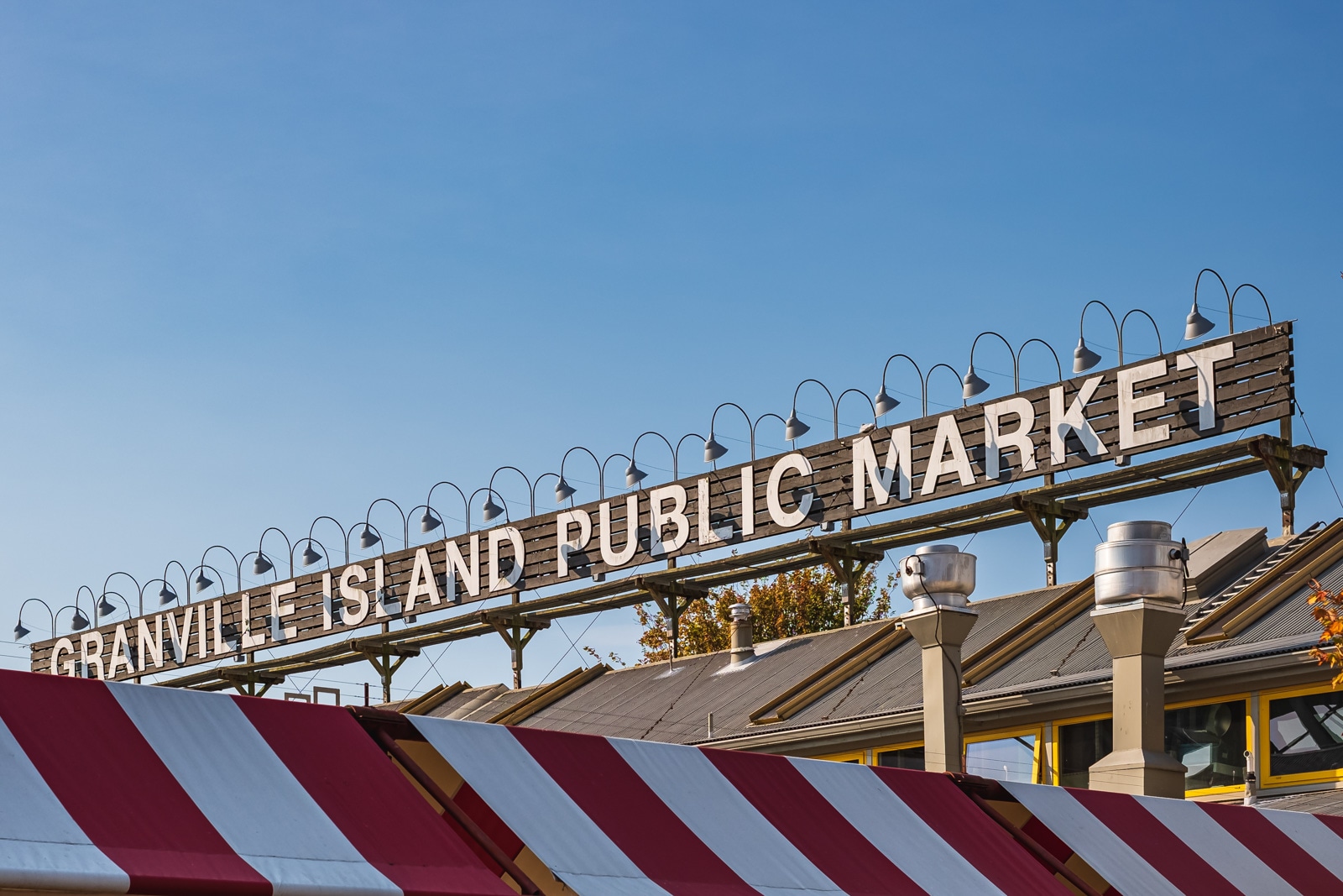 A large wooden facade reads Granville Island Public Market.