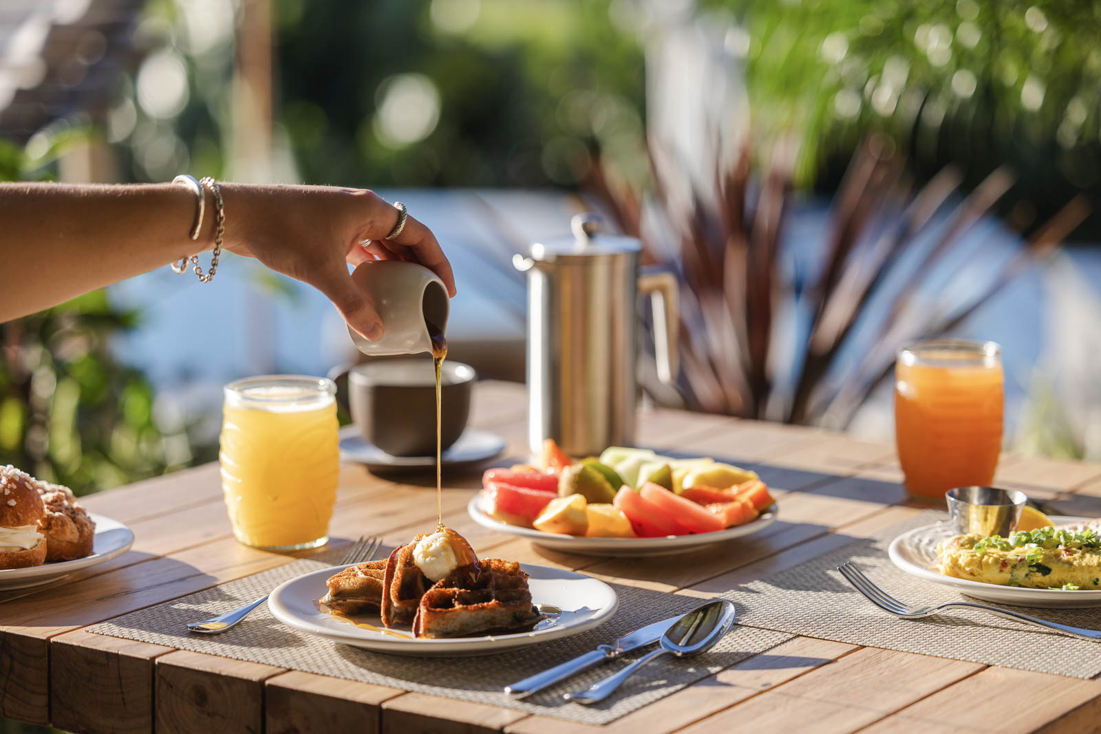 Breakfast spread of juice and waffles