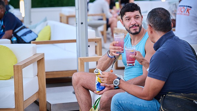 Two people drinking in the chase terrace